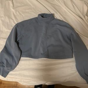 A light ocean blue long sleeve crop top